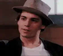 River Phoenix in a hat