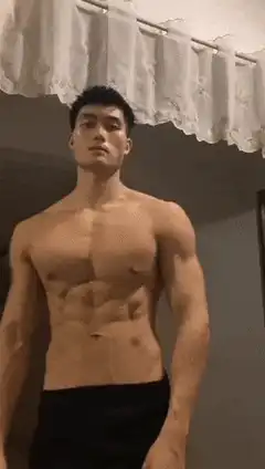 Muscular man flexing abs