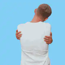 Man scratching back then turning around