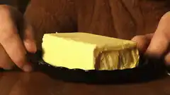 Red devil eats butter and scares man