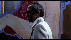 The Godfather walking past fish sign
