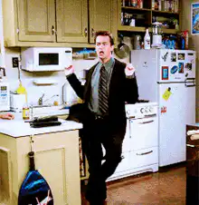 Ross dancing in the kitchen