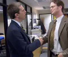 Dwight and Andy shake hands awkwardly