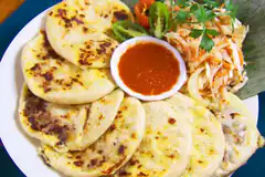 plate of parathas with chutney and salad