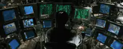Person in front of multiple monitors