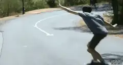 skateboarder jumps off board and falls