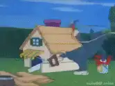 Tom painting a house roof red