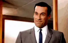 Don Draper smoking and smiling