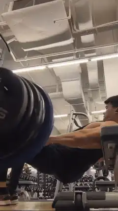 Man doing hip thrusts with barbell
