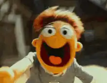 Elmo pointing and smiling