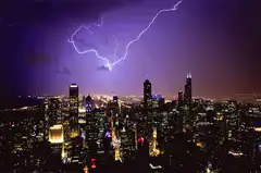 Lightning strikes over city skyline