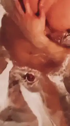 Close-up of body in soapy water