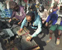 Zombie DJ playing a mixing board
