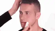 Man gets made up as a clown