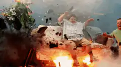 Men blown backward by explosion