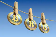 Bitcoin coins on a clothesline