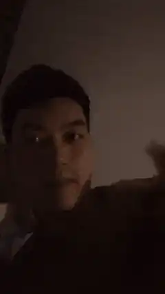 Man in dim room with blurry camera movements