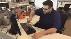 Man spills coffee on keyboard