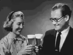 Couple toasting with beer