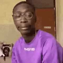 Man takes off glasses and looks up