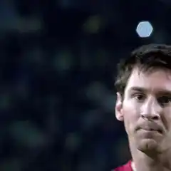 Lionel Messi winking and pointing