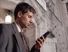 Fox Mulder checks pager All Done Bye Bye