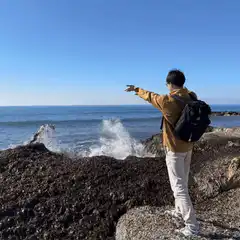 Man splashes water on rocks
