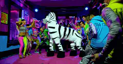 Group dancing with inflatable zebra