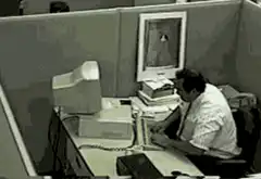 Man smashes computer monitor in office