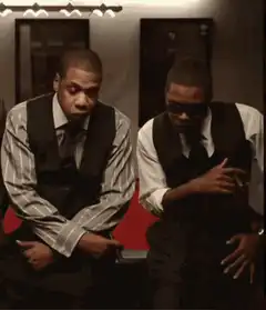 Jay-Z and Diddy nodding in an elevator