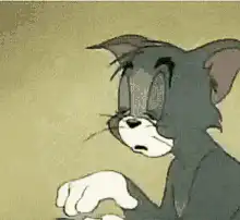 Tom from Tom and Jerry wiping his forehead