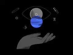 Hand holding blue planet under eye