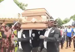 Pallbearers drop coffin and fall over