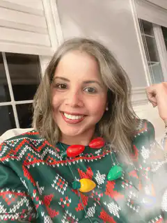 Woman in Christmas sweater with animated lights