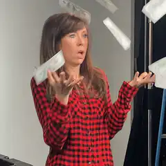 Woman surprised by falling plastic bags