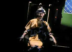 Man getting electrocuted in chair