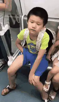 Boy on subway looking around