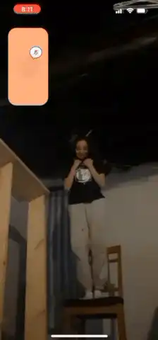 Girl on chair falls over