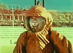 Man in vintage diving suit laughing