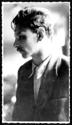 black and white portrait of man with mustache