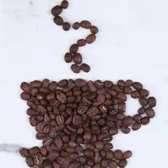 Coffee beans forming a cup and steam