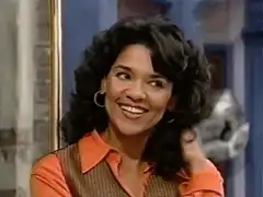 Julia smiling and touching her hair
