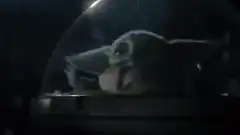 Baby Yoda in a glass dome