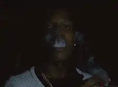 A$AP Rocky smoking and exhaling smoke
