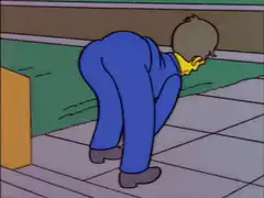 Man in blue suit bending over