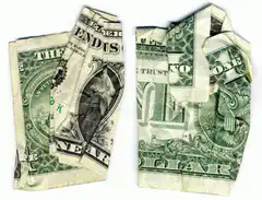 Money folded into a fist