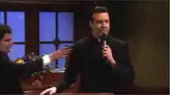 Charlie Sheen grabs microphone from priest