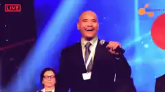 Jeff Bezos laughing on stage