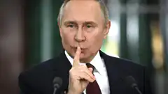 Vladimir Putin shushing