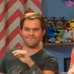 Man makes shaka sign and smiles